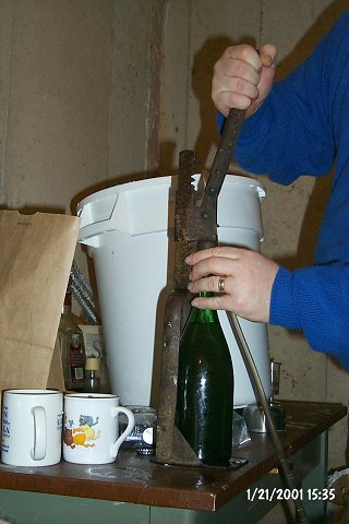After filling, each bottle is capped using one of the hand-capping tools. Silver caps are one flavor, Pepsi&reg; caps another (no, not Pepsi...)