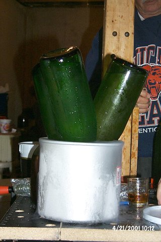 After cooling down in regular ice, the bottles are placed in a solution of dry ice and isopropyl alcohol to freeze the yeast remnants in the neck.