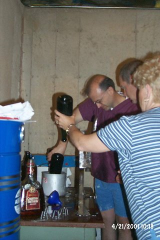 A bottle being transferred from the ice chest to the dry ice bath.