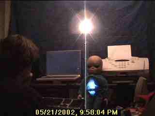 Photo: Alien facing you with a footprint-shaped blue glow in his middle.